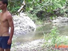 Spicy boys having oral foreplay on the rocky bank