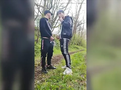 Two hot, horny boys smoking and wanking their dicks outdoors